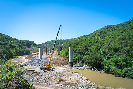 Newly built bridge under construction over the river, Georgia