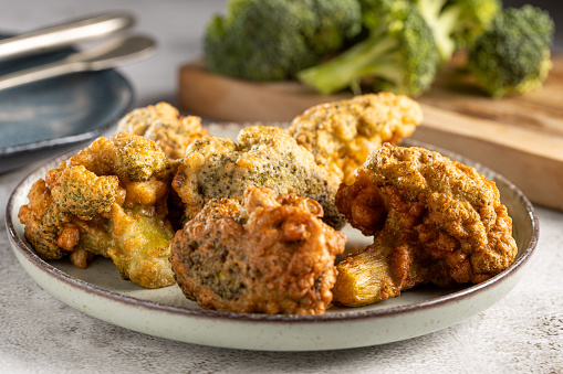 Fried breaded broccoli on the table.