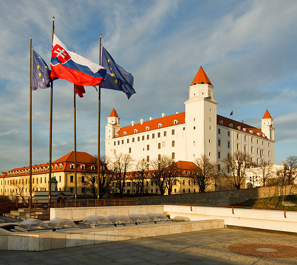 Bratislava castle with flags stock photo