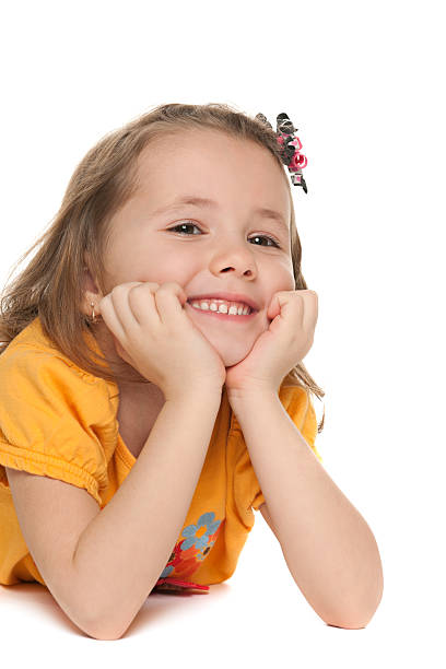 istock Smiling small girl in a yellow shirt 164006669