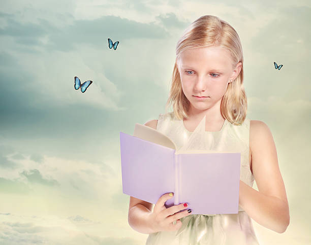 istock Little Blonde Girl Reading a Book 164009160
