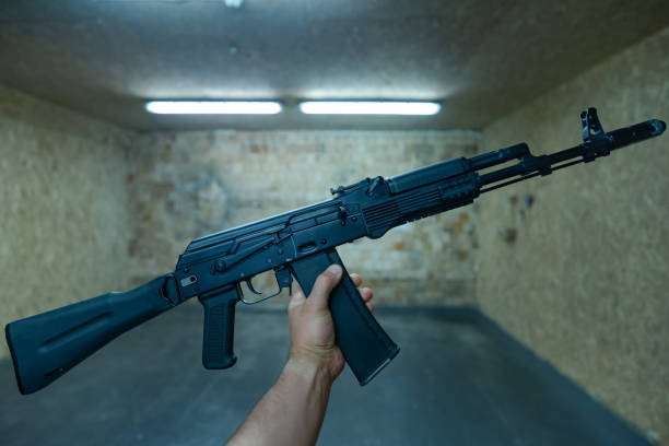 istock Rifle in the hand of a men in a shooting range 1640095215