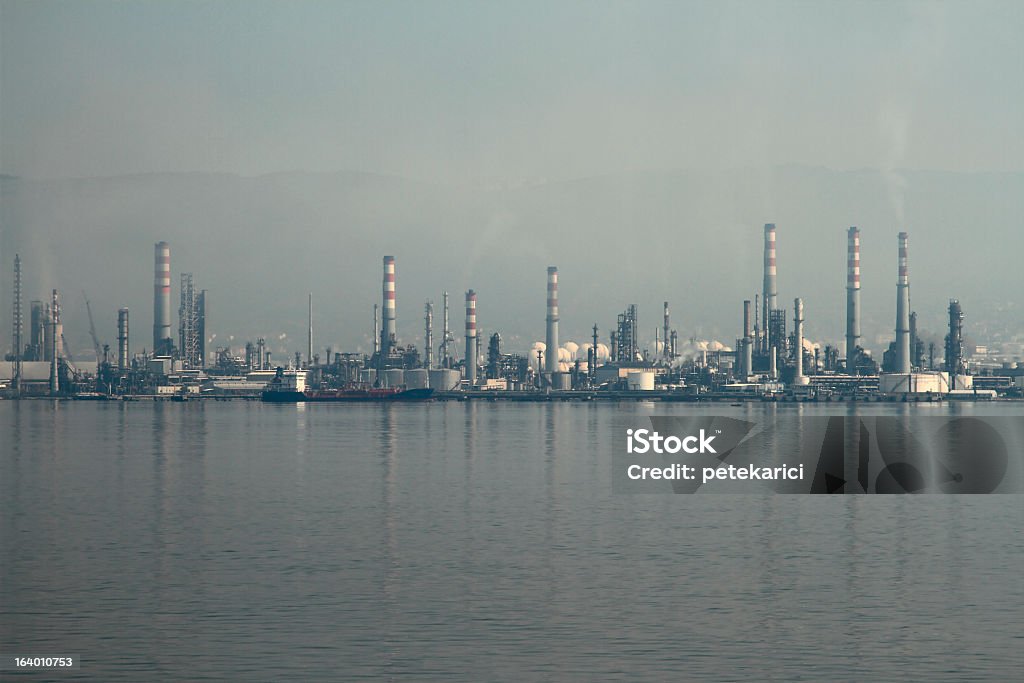 Factory Pollution Factory, refinery on blue sky. Air Pollution Stock Photo