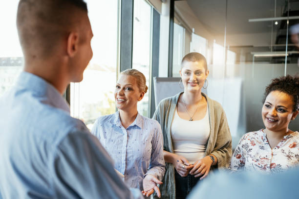istock Businesswomen working in team in modern corporate office 1640118754