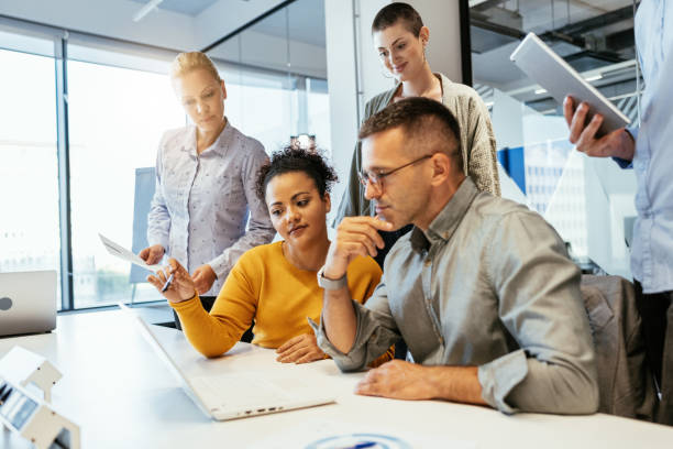 istock Multiethnic business people working together on start up project in modern office 1640119806