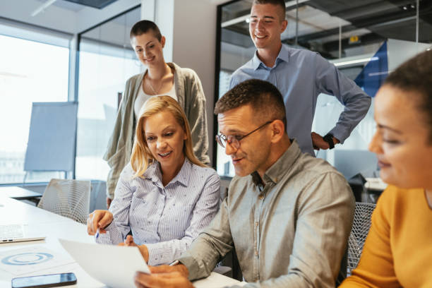 istock Businesswomen working in team in modern corporate office 1640120862