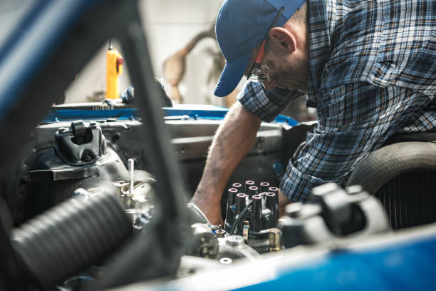 istock Car Mechanic Repairs a Classic Car Inside His Workshop 1640121923
