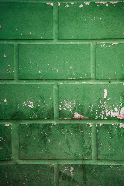 istock Sea green broken cracked brick wall. 1640154764