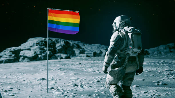 istock Astronaut reaches the moon and discovers a rainbow colored flag 1640155287