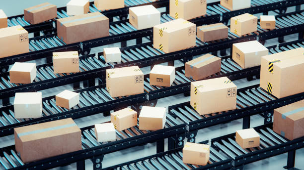 istock Warehouse  with conveyor belt full of packages ready for distribution 1640156384