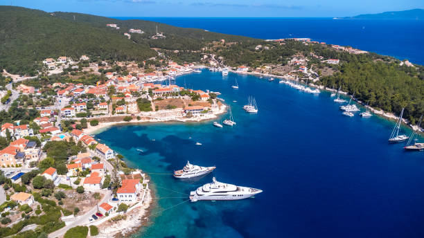 Aerial drone view of Fiskardo village port on Kefalonia island, Greece Aerial drone view of Fiskardo village port on Kefalonia island, Greece paradisaeidae stock pictures, royalty-free photos & images