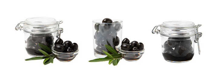 Delicious black olives in a jar isolated on a white background. Pickled olives in a glass jar. Delicious olives. Close-up. Vegan.Collage. Design.