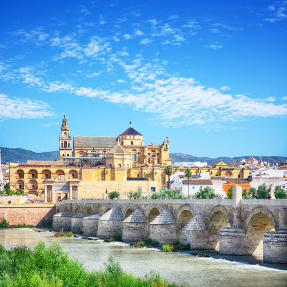 Roman Bridge and Guadalquivir river in Cordoba, Spain. Composite photo