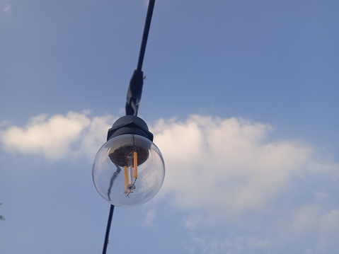 incandescent garden lamp with sky background