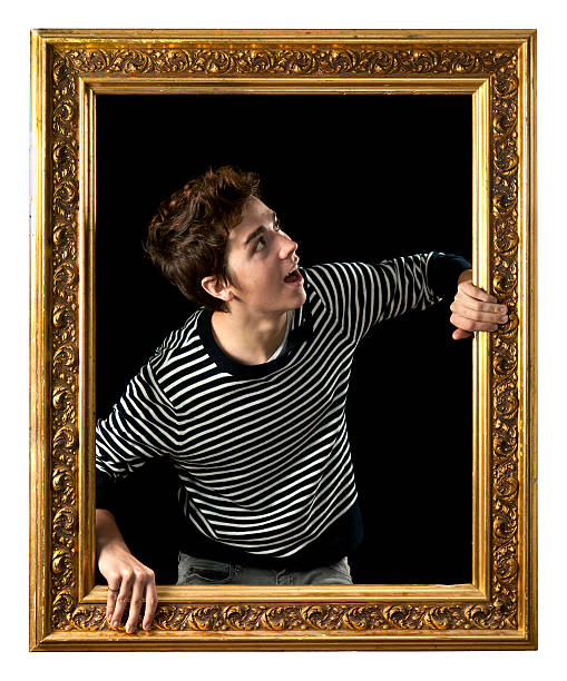 istock Young Man Coming out of Picture Frame 164019475