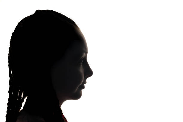istock The girl portrait profile in silhouette shadow on studio. 1640200022