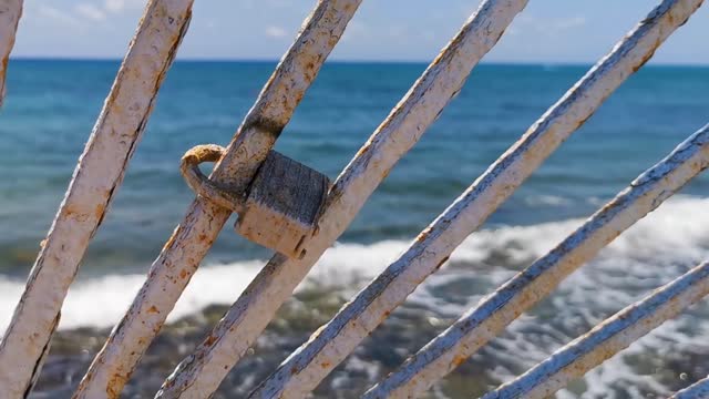 Lock on metal railing on beach Playa del Carmen Mexico.