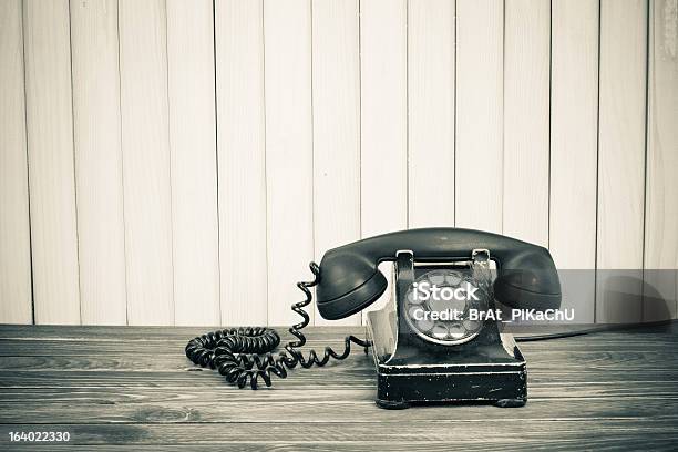 Vintage Telephone On Old Table Sepia Photo Stock Photo - Download Image Now - Aging Process, Analog, Antique
