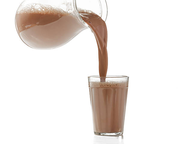 istock pouring milk chocolate into a glass 164022354