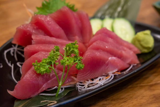 istock Tuna sashimi with vegetable on plate, served in a restaurant 1640223771