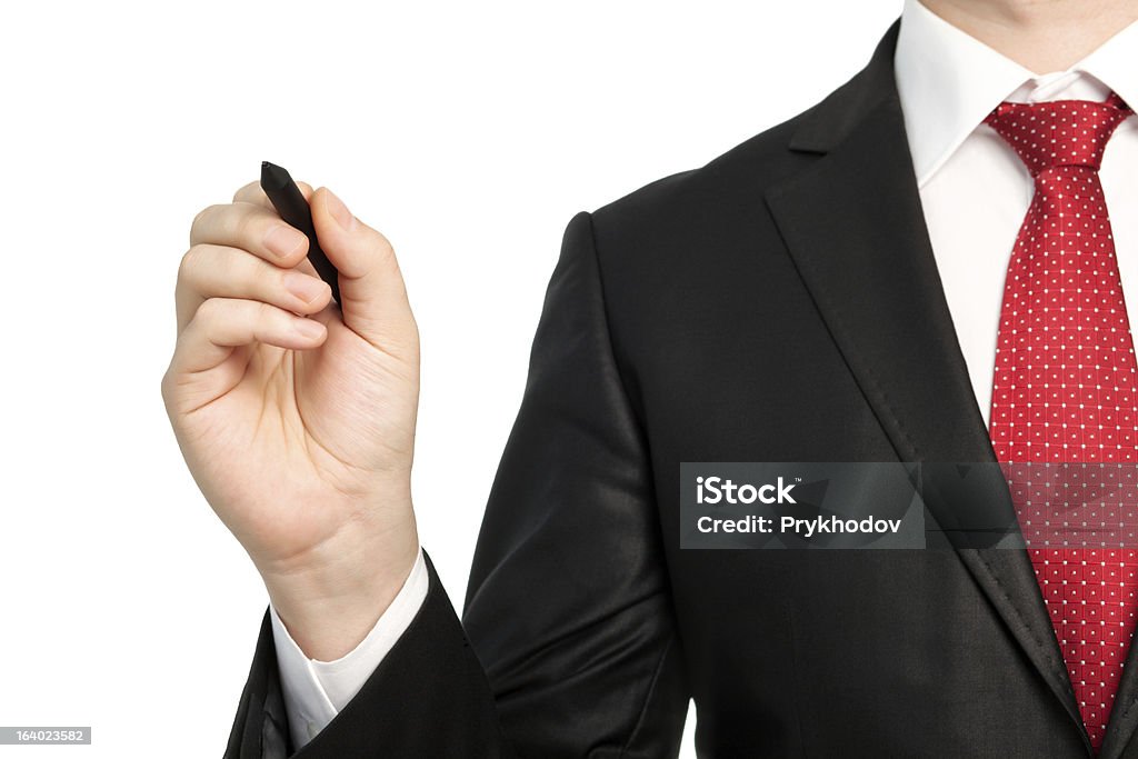 Empresario aislado en un traje con corbata roja de sujeción de lápiz - Foto de stock de Director ejecutivo de empresa libre de derechos