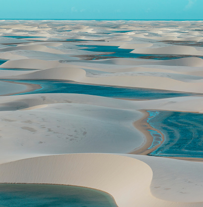 Aerial view of Lencois Maranhenses. White sand dunes with pools of fresh and transparent water. Desert. Barreirinhas. Maranhao State National Park. Brazil
