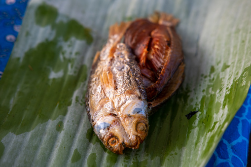 Fried sun-dried fish, served on banana leaf