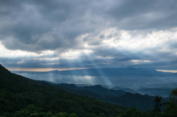 istock Heavenly Glows: Watch Crepuscular Rays amidst Transforming Clouds on the Peak. 1640275073