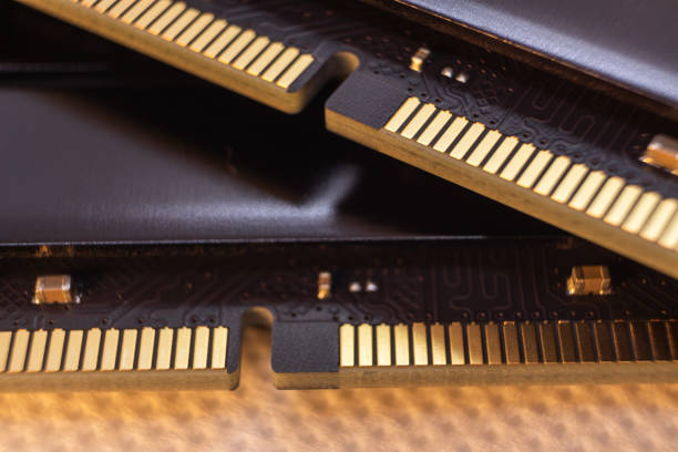 DDR4 DRAM memory module electrical contact macro DDR4 DRAM memory module golden electrical contact macro. Computer RAM chip close-up. Desktop PC memory motherboard ram slots stock pictures, royalty-free photos & images