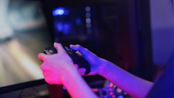 istock Hand of female cyber hacker gamer holding controller joystick to playing games on computer 1640282798