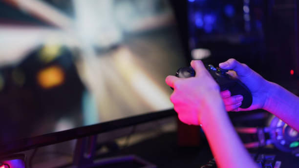 istock Hand of female cyber hacker gamer holding controller joystick to playing games on computer 1640282809