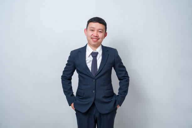istock Businessman wearing navy blue suit on white background. 1640293637