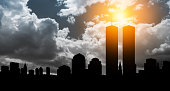 New York skyline silhouette with Twin Towers at sunset. American Patriot Day banner.