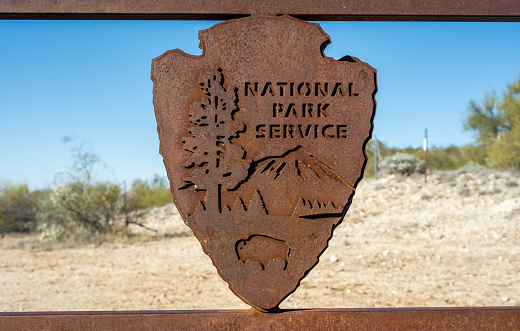 Tucson, United States: January 24, 2023: Metal National Park Sign on Gate at entrance to Saguaro wilderness