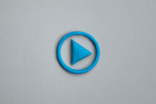 3d simple play button, 3d media play sign on grey background. Plasticine object. Control panel concept.