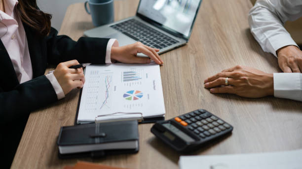 istock Business executive reading finance document to brainstorming about new startup project with partner 1640311861
