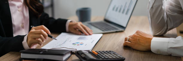 istock Business executive reading finance document to brainstorming about new startup project with partner 1640311919
