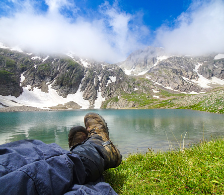 hiker legs with lake and Mountain View