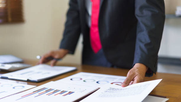 istock Business analysis concept, Senior businessman is thinking strategy and analyzing business chart 1640337207