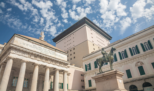 Genoa, Italy - 2022, September 6 : The Carlo Felice theatre, the opera house of the Italian city of Genoa, and the statue of Giuseppe Garibaldi