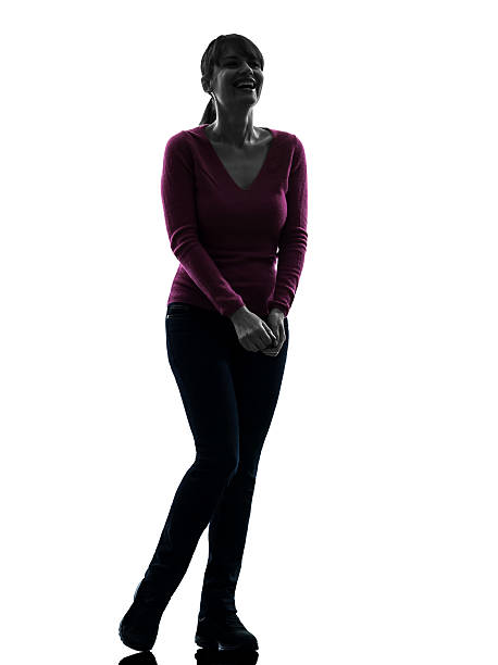 one caucasian woman happy laughing full length  in silhouette studio on white background