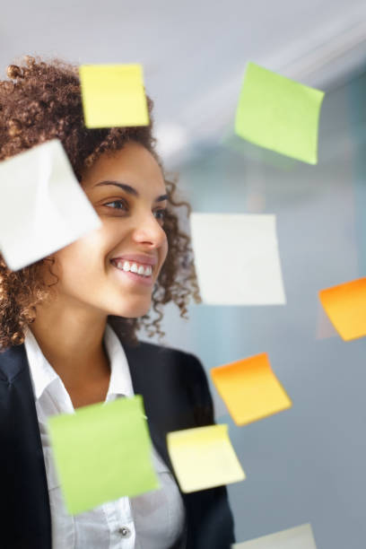 istock Business woman looking at sticky notes 164038845