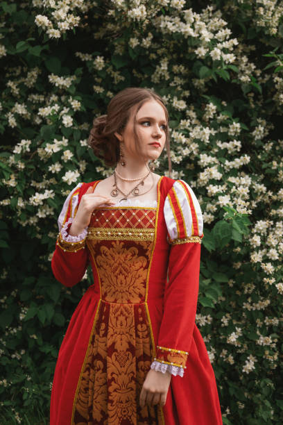 istock Medieval princess in blooming garden 1640396178