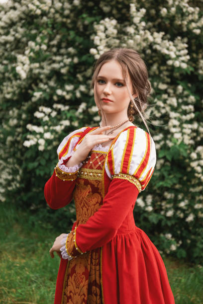 istock Medieval princess in blooming garden 1640396179