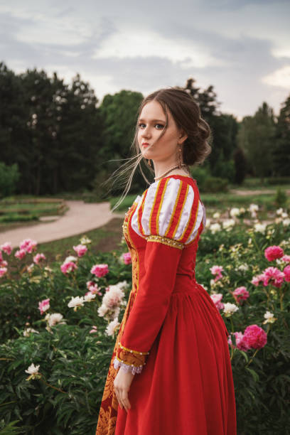 istock Medieval princess in peony garden 1640396687