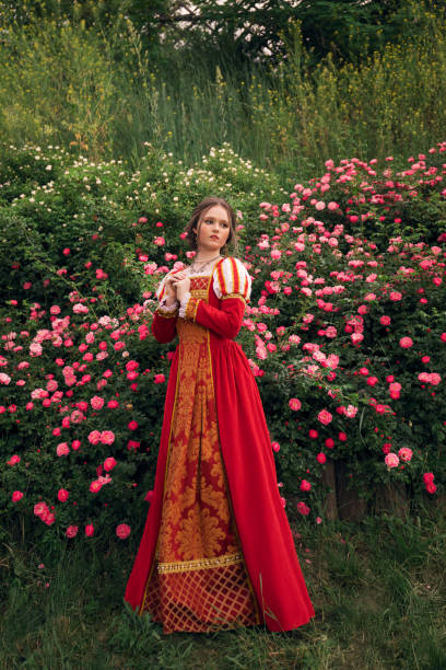 istock Medieval princess in rose garden 1640396723