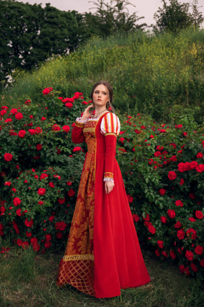 istock Medieval princess in rose garden 1640397230