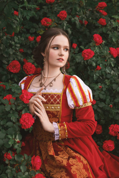 istock Medieval princess in rose garden 1640397242