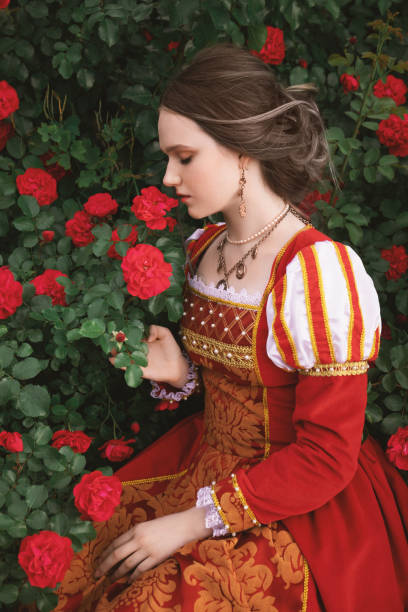 istock Medieval princess in rose garden 1640397693