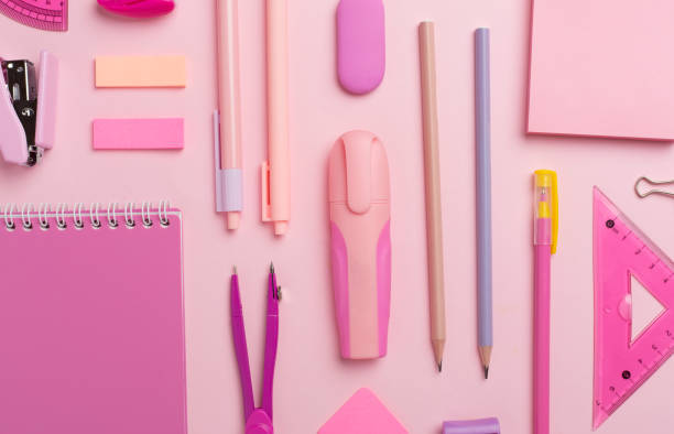 istock Pattern with pink school stationery on color backgroung, top view 1640402637